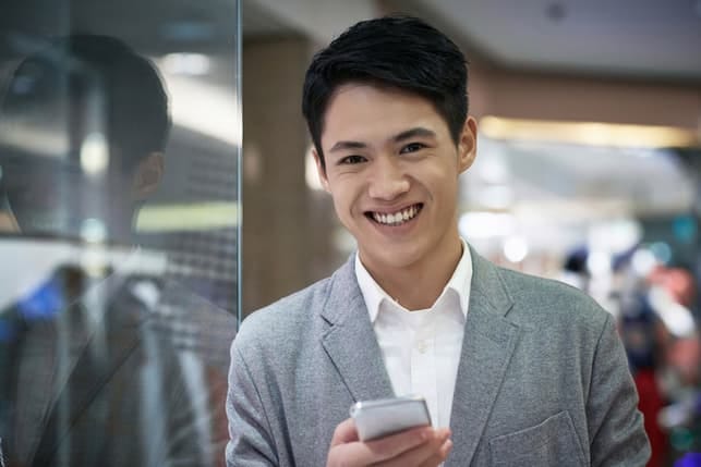 a young asian guy smiling