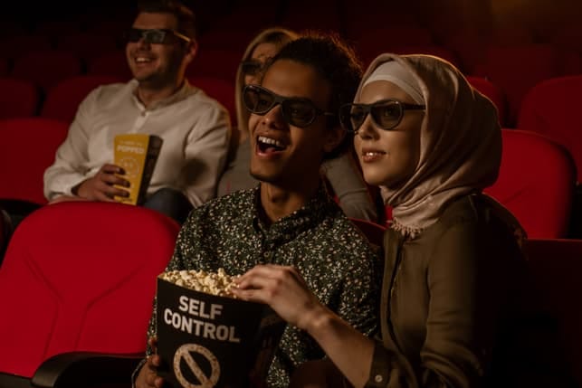 a young couple enjoying a cinema date