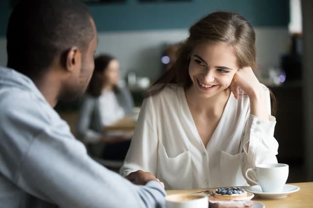 a young couple is flirting in a classroom