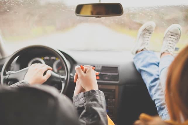 couple driving through the picturesque landscapes