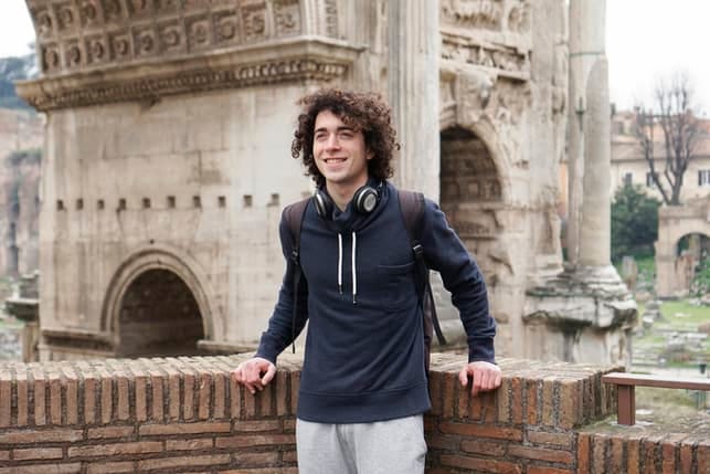 a young curly guy sightseeing