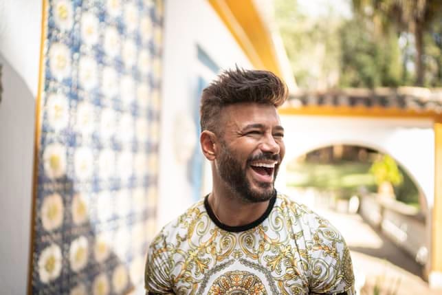 a portrait of a happy bearded man