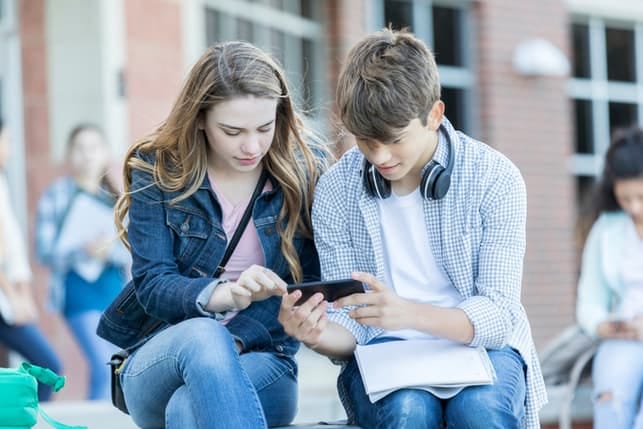 a young couple hanging out outdoors