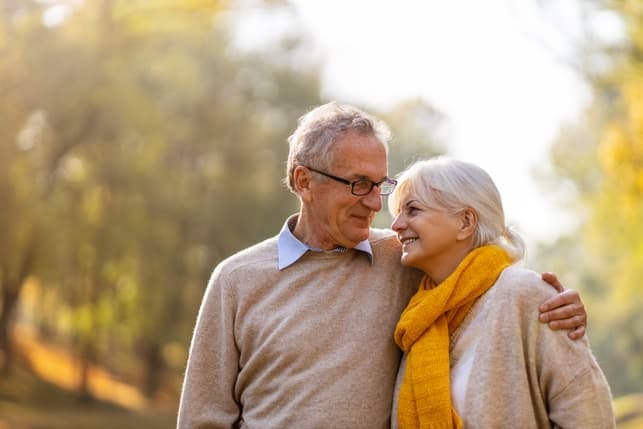 a nice senior couple having a walk together