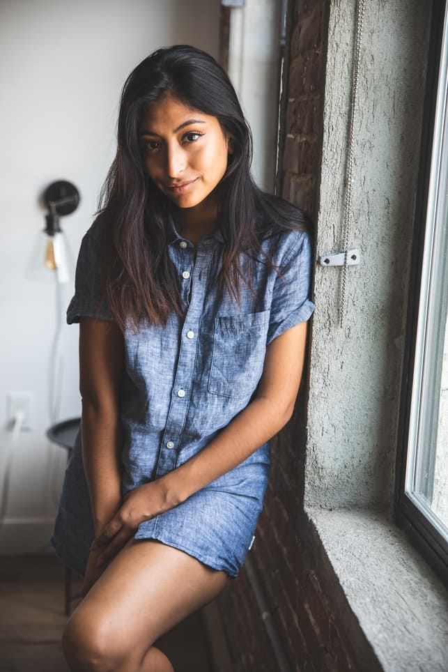 a modern indian woman posing indoors