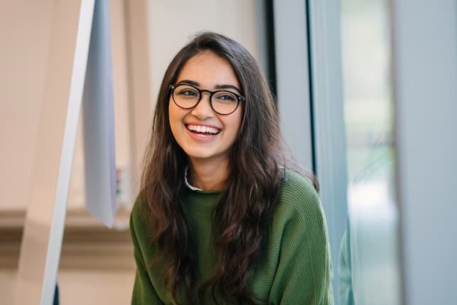 a happy young woman smiling