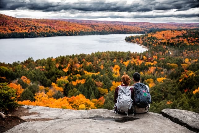 a couple is hiking together and enjoying nature