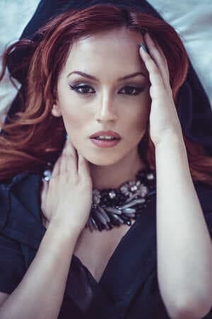 a portrait of a beautiful redhead woman