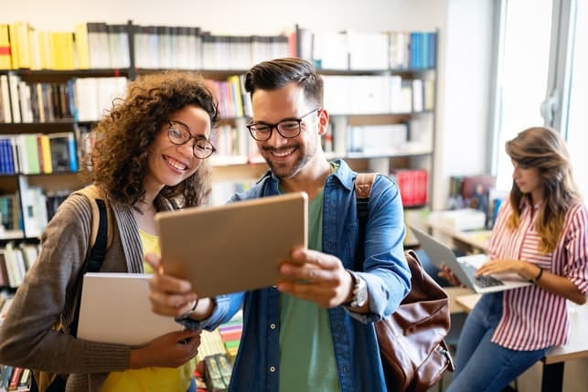 a young couple using a laptop together