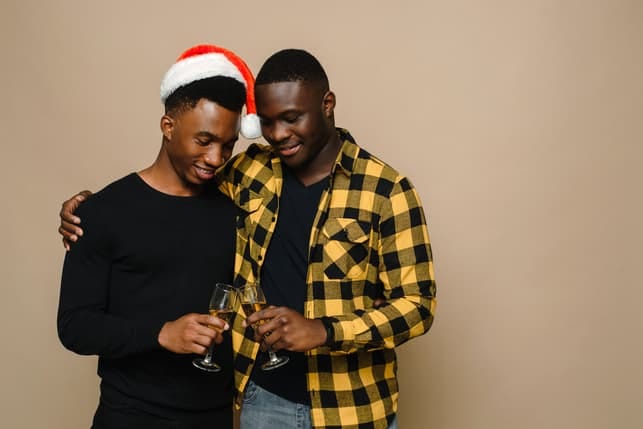 a black gay couple celebrating xmas together