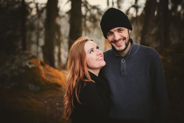 a girl looking at her tall boyfriend affectionately