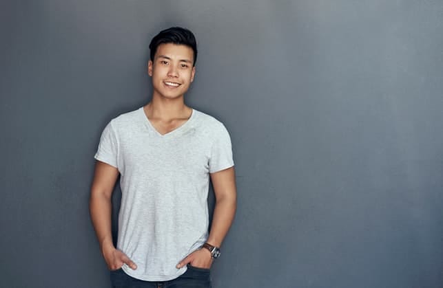 a portrait of a young Asian man in a white T-shirt