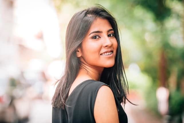 magnificent girl smiling over shoulder