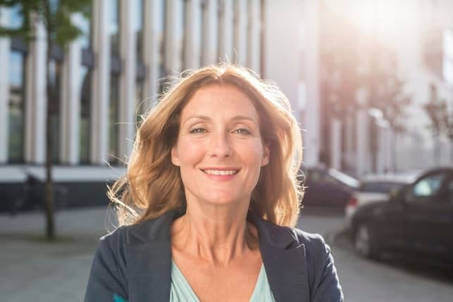 a portrait of a beautiful blonde woman over 40