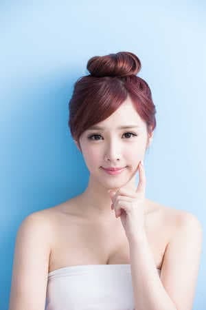 cheerful Korean girl with a light smile