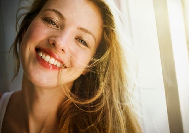 a portrait of a blonde young woman